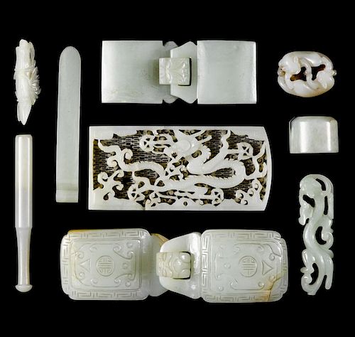 Chinese carved jade, to include belt buckles, a dragon plaque, an archer's ring, etc.