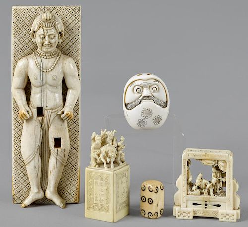 Five pieces of Asian carved ivory, late 19th c., to include a figural incense holder, cube, netsuk