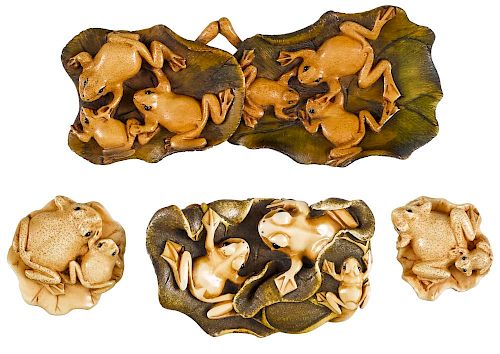 Four Japanese Meiji period carved ivory pendants and netsuke of frogs on lily pads, longest - 5 1/