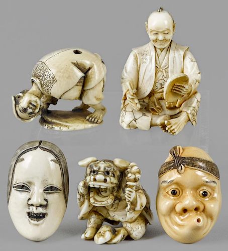 Five Japanese Meiji period carved ivory netsukes, to include two masks and three figures with mask