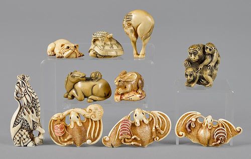 Ten Japanese Meiji period carved ivory netsukes, to include a bat, dog, rabbit, dragon, etc.
