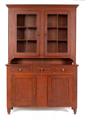 Pennsylvania painted poplar Dutch cupboard, ca. 1835, retaining its original red stained surface,