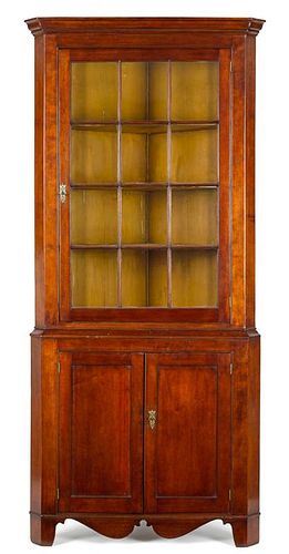 Pennsylvania cherry two-part corner cupboard, early 19th c., 87 3/4'' h., 36 1/2'' w.