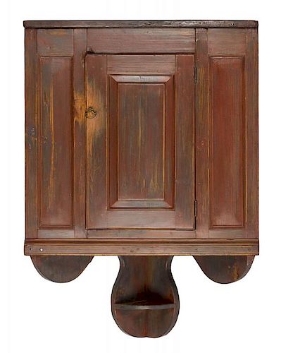 Pennsylvania pine hanging corner cupboard, ca. 1800, retaining a scrubbed red surface, 45 1/2'' h.,