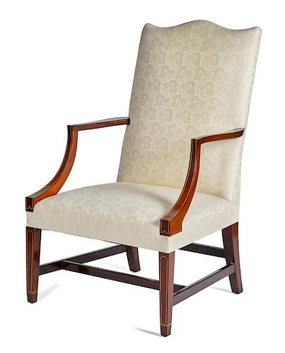 Kindel Winterthur Reproduction mahogany lolling chair, with line inlay.