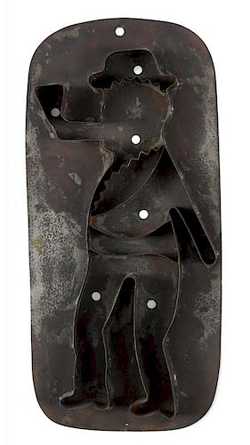 Tinned iron man with pipe cookie cutter, late 19th c., 14 1/8'' h.