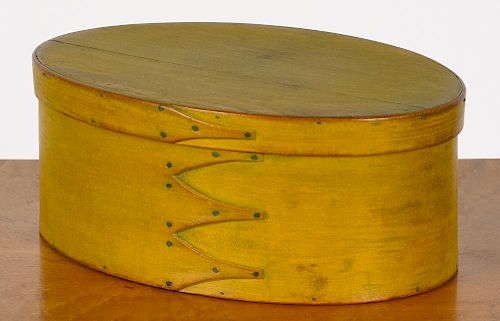Shaker bentwood box, 19th c., retaining its original yellow surface, 4 3/4'' h., 12'' w.