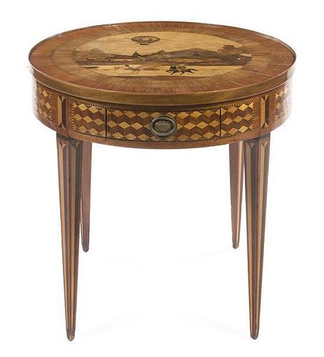 A Louis XVI Style Marquetry and Parquetry Inlaid Games Table, Height 30 1/8 x diameter 31 3/4 inches.