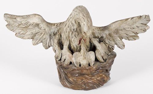 Carved and painted figure of an eagle and its young, 19th c., the bird piercing its breast, 6'' h.,