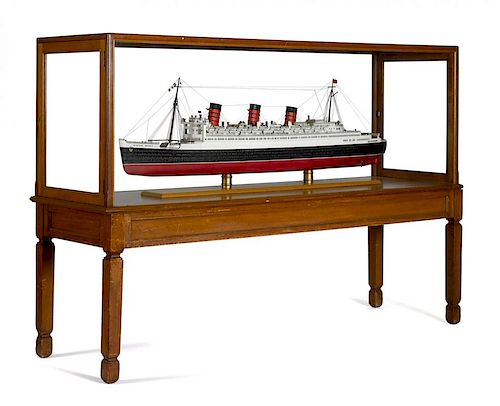 Large model of the cruise ship Queen Mary, by Lannan Ship Model Co., Boston, with mahogany stand