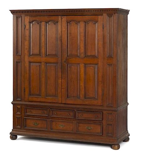 Pennsylvania or New York cherry schrank, late 18th c., with dentil cornice and raised panel doors,