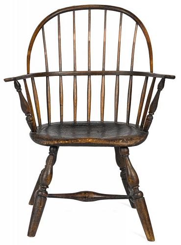 New England sackback Windsor armchair, ca. 1790, retaining an old weathered black surface over the