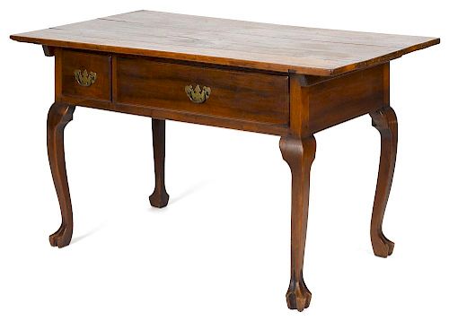 Pennsylvania walnut tavern table, 19th c., with two drawers and trifid feet, 29'' h., 51 1/2'' w., 2