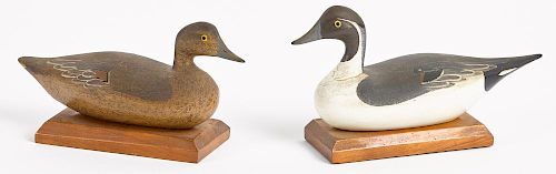 Pair of carved and painted miniature canvasback duck decoys, mid 20th c., 6'' l.