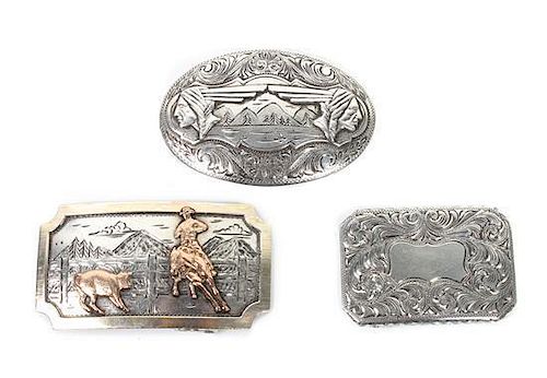 Three Comstock Heritage Sterling Silver Trophy Buckles Height of largest 1 3/4 x width 3 inches.
