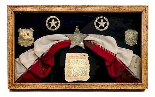 A Framed Collection of Contemporary "Tin Star" Marshall Badges First 10 1/4 x 17 inches.