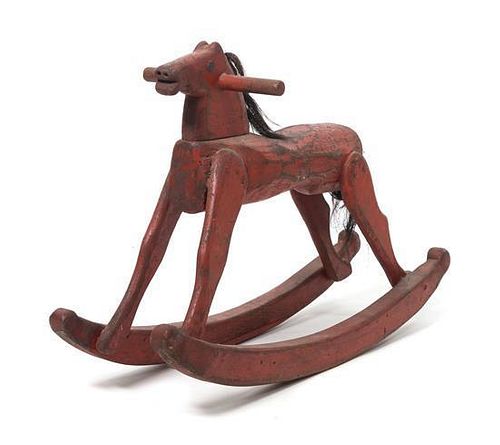 A Vintage Painted Wood Rocking Horse Height 19 x length 29 inches.