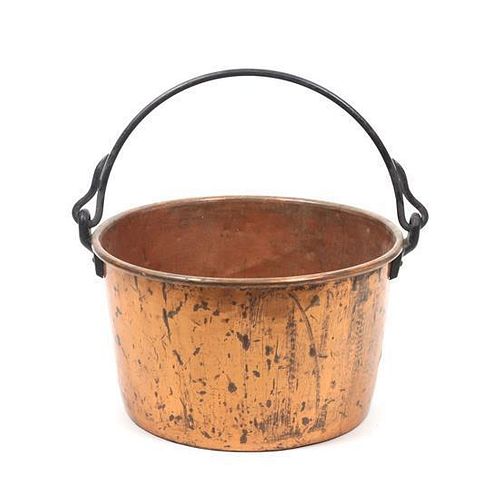 A Large Copper Cauldron Height 14 1/2 x diameter 26 1/2 inches.