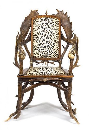 A Continental Oak Antler and Horn Arm Chair Height 42 inches.