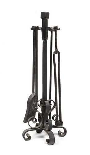 A Wrought Iron Fireplace Tool Set Height 33 inches.
