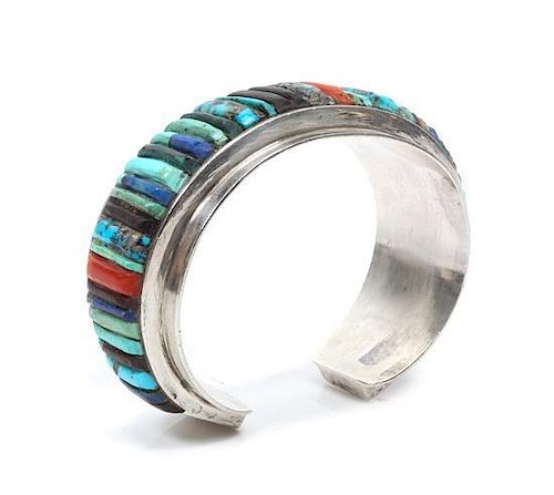 A Hopi Silver, Turquoise, Lapis and Multi-Gem Bracelet, Charles Loloma Length 5 3/4 x opening 7/8 x width 1 1/8 inches.
