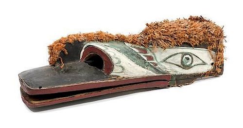 A Kwakwaka'wakw Painted Wood Mask Height 9 x length 30 x width 8 1/2 inches.