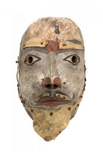 A Kwakwaka'wakw Painted Wood Mask Length 11 1/2 x width 7 x depth 5 1/2 inches.