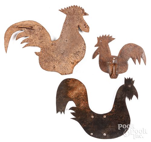 Two sheet iron rooster weathervanes