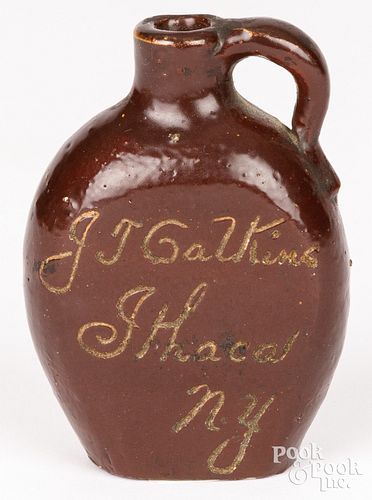 Miniature Albany slip advertising stoneware jug