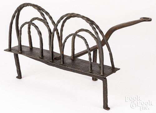 Wrought iron revolving toaster, 19th c.