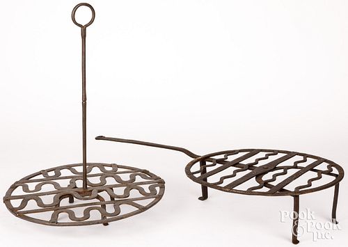 Two wrought iron trivets, 19th c.