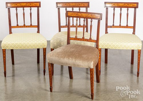 Four George III inlaid mahogany dining chairs