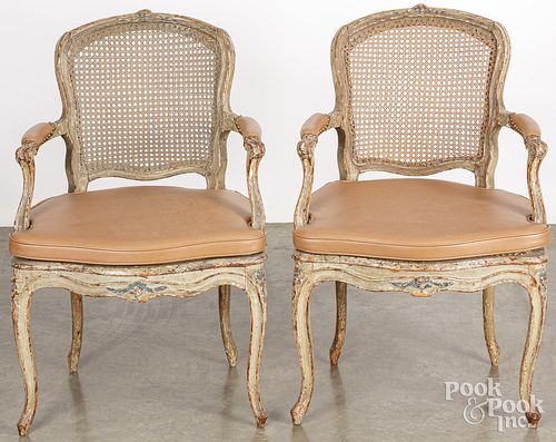 Pair of French painted cane seat arm chairs