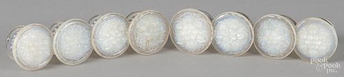 Eight New England clambroth glass furniture knobs.
