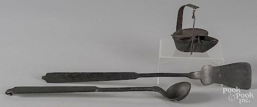 Wrought iron spatula and tasting ladle, 19th c., together with a fat lamp.