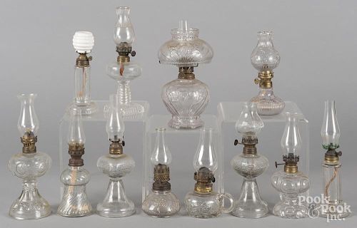 Collection of colorless glass fairy lamps.
