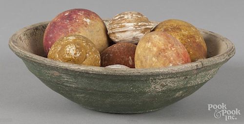 Painted wood bowl. 9'' dia., together with a group of stone fruit, 9'' dia.