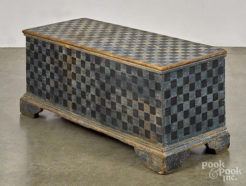 Painted pine blanket chest, 19th c., retaining an old blue surface with later black checkering, 18 1