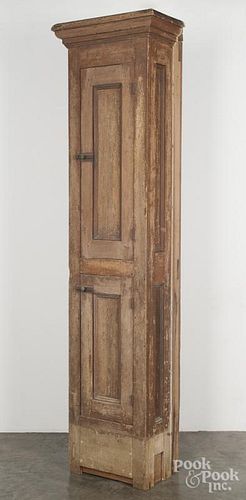Painted chimney cupboard, late 19th c., retaining remnants of its original ochre surface, 83 1/2'' h.