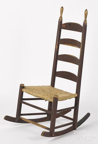 Painted ladderback rocking chair, 19th c., probably Southern, retaining an old red surface.