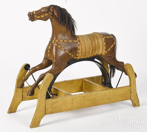 Carved and painted hobby horse, late 19th c., 36'' h., 44'' w.