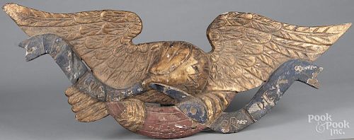 Carved and painted eagle stern board plaque, 20th c., 46'' l.