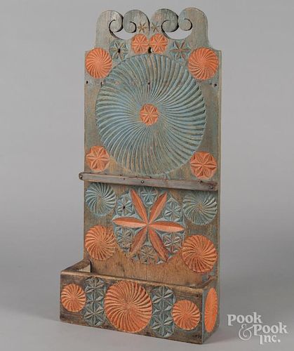 Continental carved and painted spoon rack, late 19th c., retaining a later decorated surface, 30'' h.