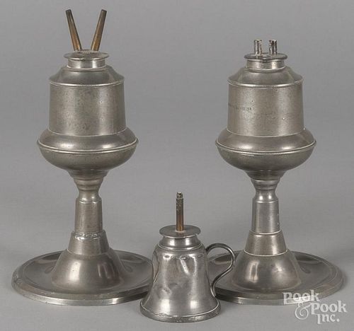 Pair of American pewter fluid lamps, 19th c., 8'' h. and 9'' h., together with a single small lamp, 3