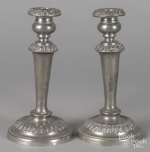 Pair of pewter candlesticks, 19th c., with embossed foliate bands, 10'' h.