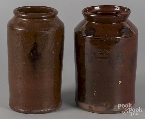 Two redware crocks, 19th c., with manganese splash decoration, 10'' h. and 10 1/4'' h.