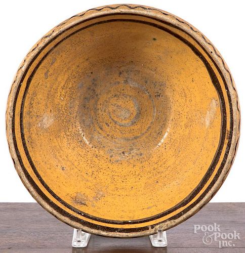 Redware mixing bowl, 19th c., with manganese slip decoration, 4 1/4'' h., 12 1/4'' dia.