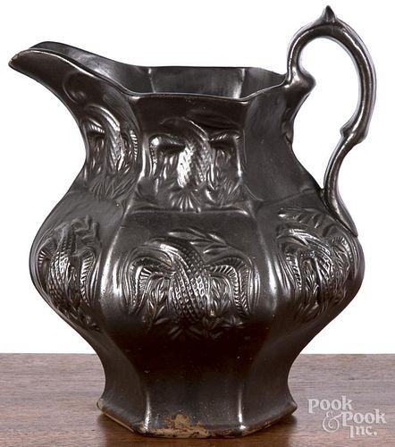 Molded pottery pitcher, 19th c., probably Woodbridge or Jersey City, New Jersey, with relief eagle d