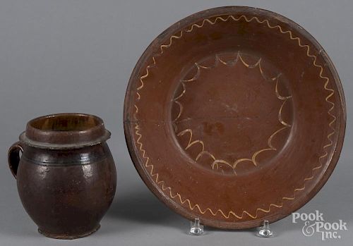 Redware mixing bowl, 19th c., with yellow slip decoration, together with a crock 3'' x 13 1/2'', 6 3/4