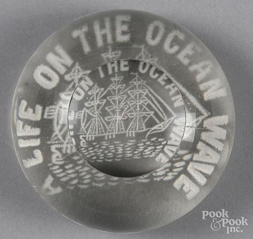 Millville, New Jersey frit paperweight, of a sailing ship, inscribed Life on the Ocean Wave, with